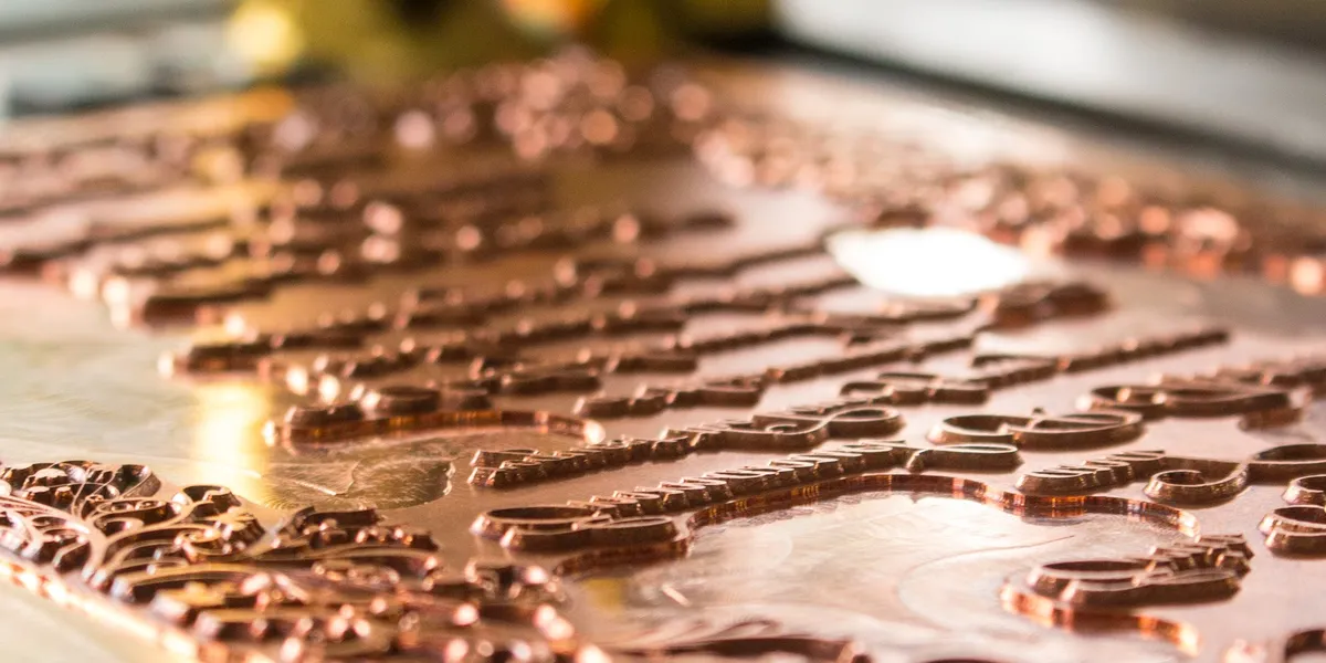 Polished copper foil stamping plate with raised type, etched in-house at Rise and Shine