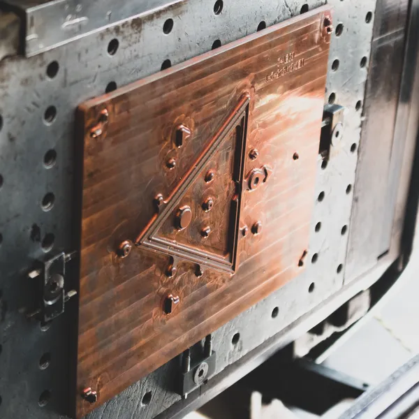 Copper foil stamping die mounted in the press base, ready to print