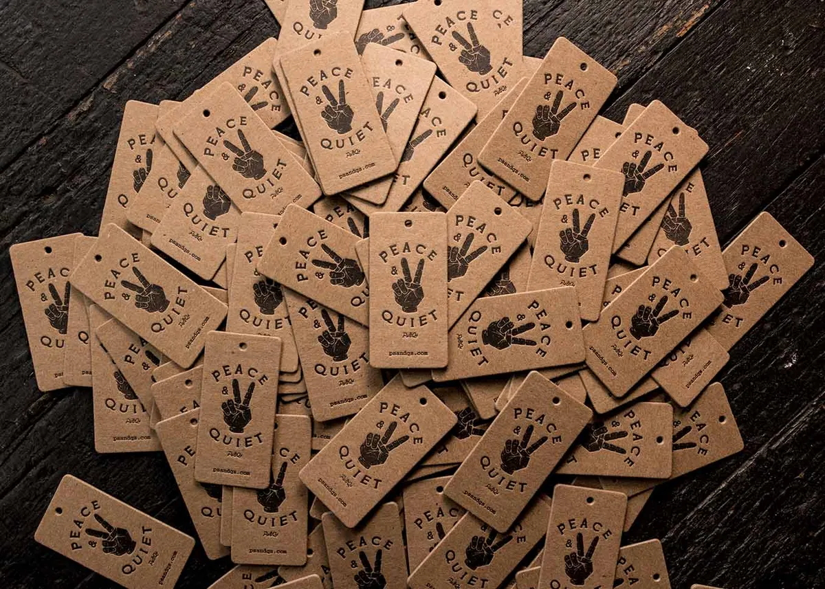 Chipboard hang tags with black ink letterpress