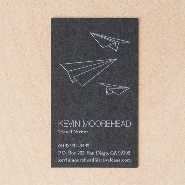 Black paper letterpress business cards printed in silver ink