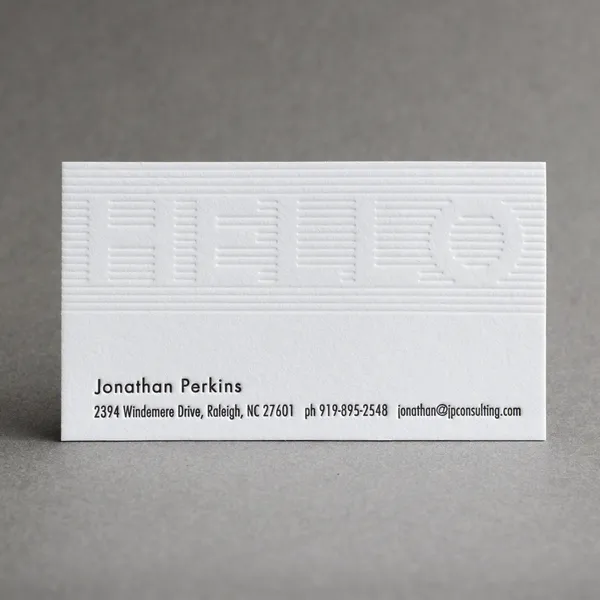 Letterpress business card with the word hello in blind deboss and colored ink