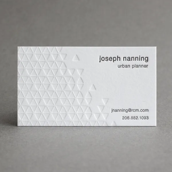 Letterpress business card with a triangle pattern in blind deboss and letterpress ink
