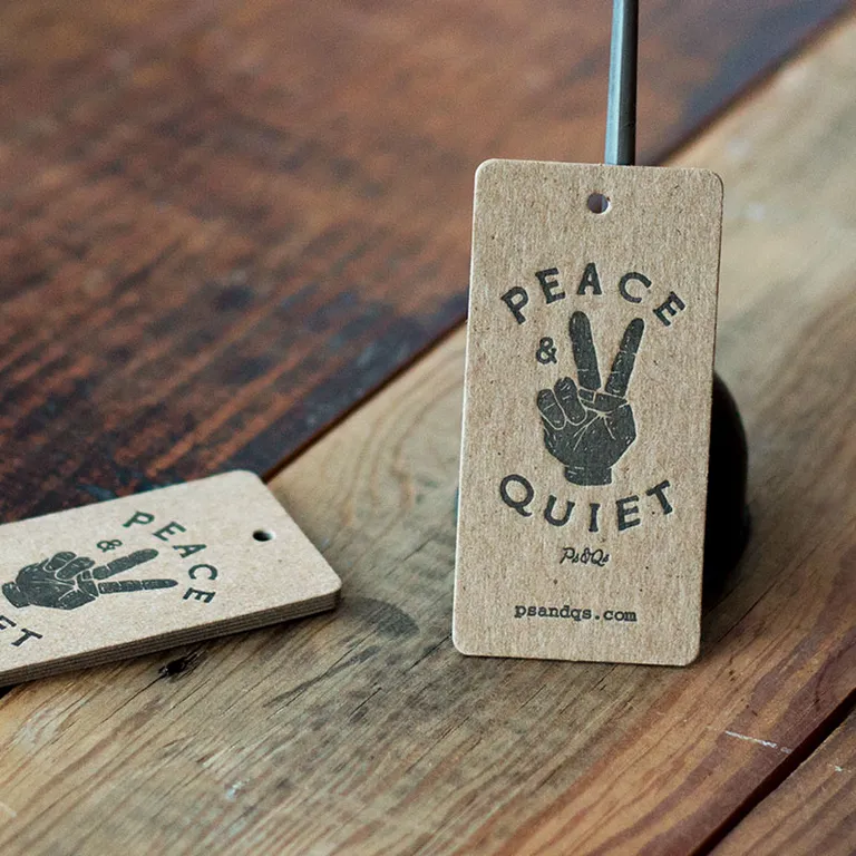 Chipboard letterpress hang tags printed in black ink