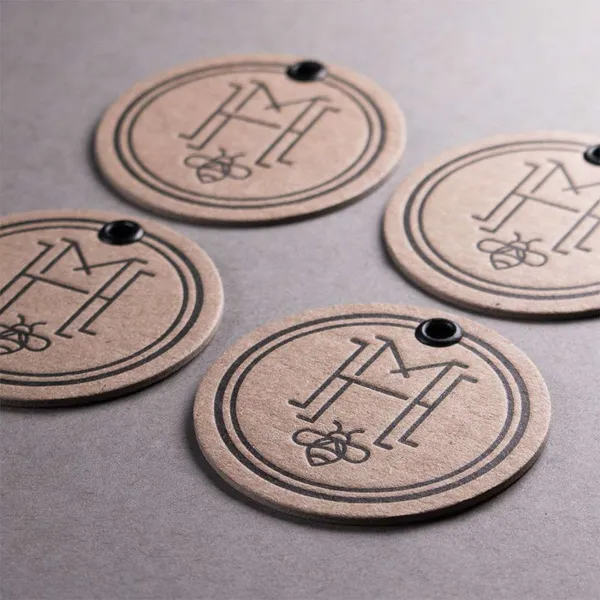 Chipboard letterpress hang tags with die-cut eyelets