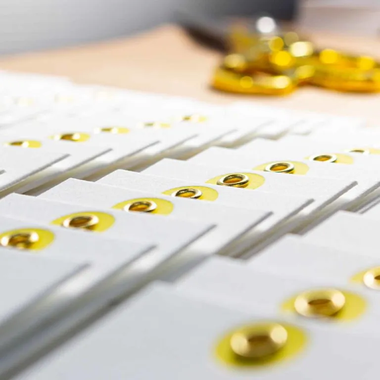 Cotton letterpress hang tag with brass eyelet