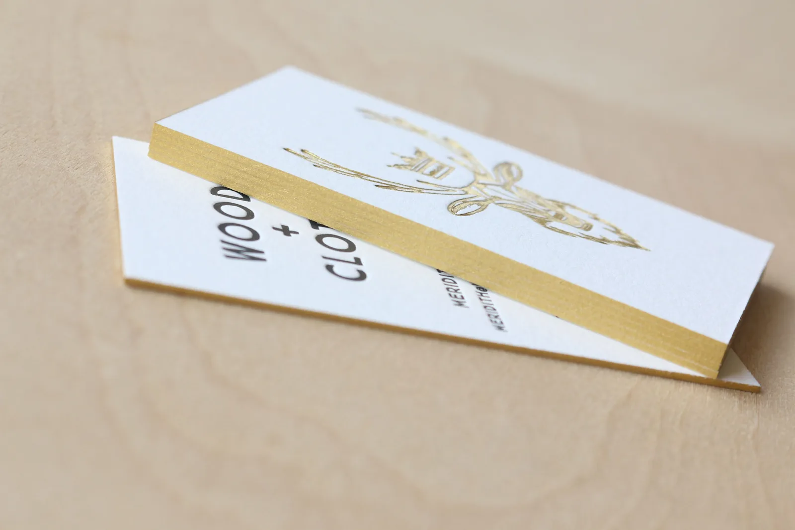 Duplexed business card with gold foil deer and black letterpress ink