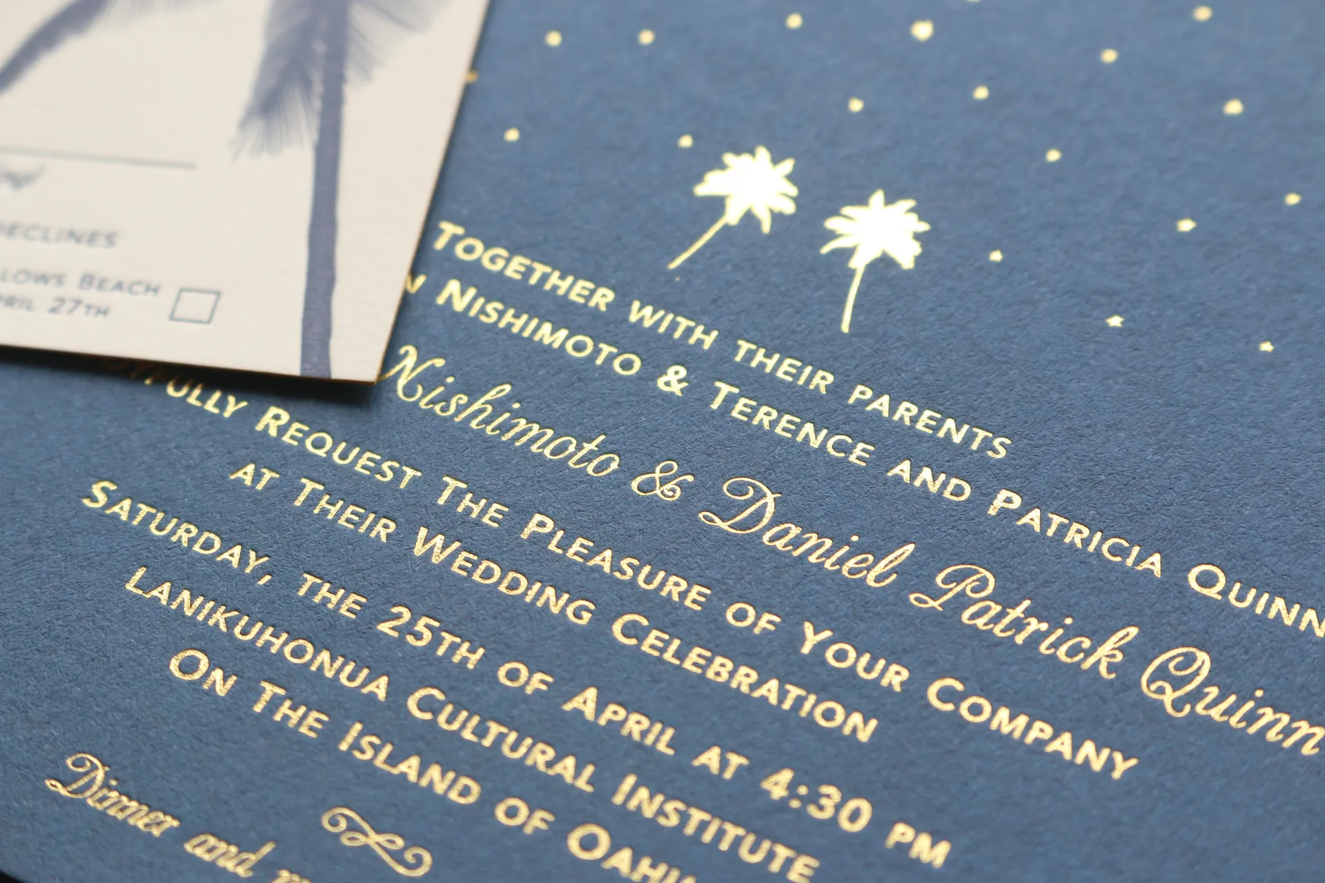 Gold foil stamped wedding invitation on navy paper