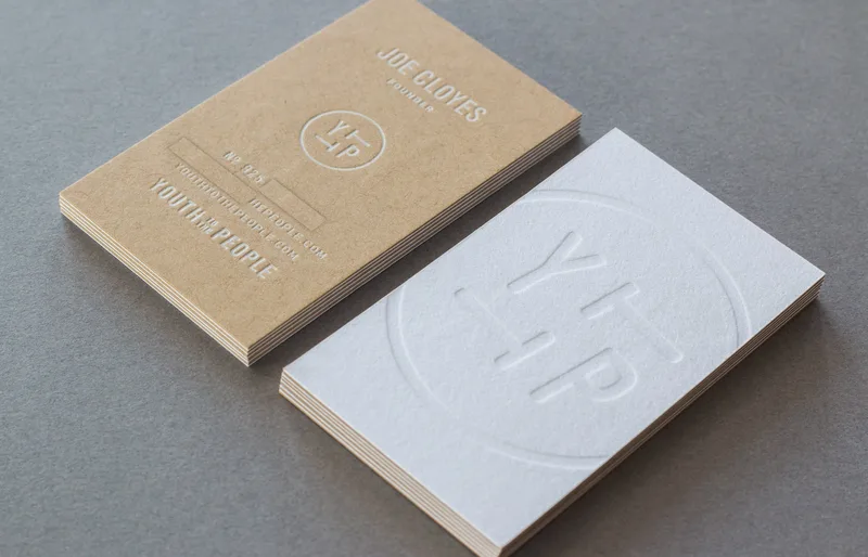 White foil and white ink letterpress on kraft paper with blind deboss