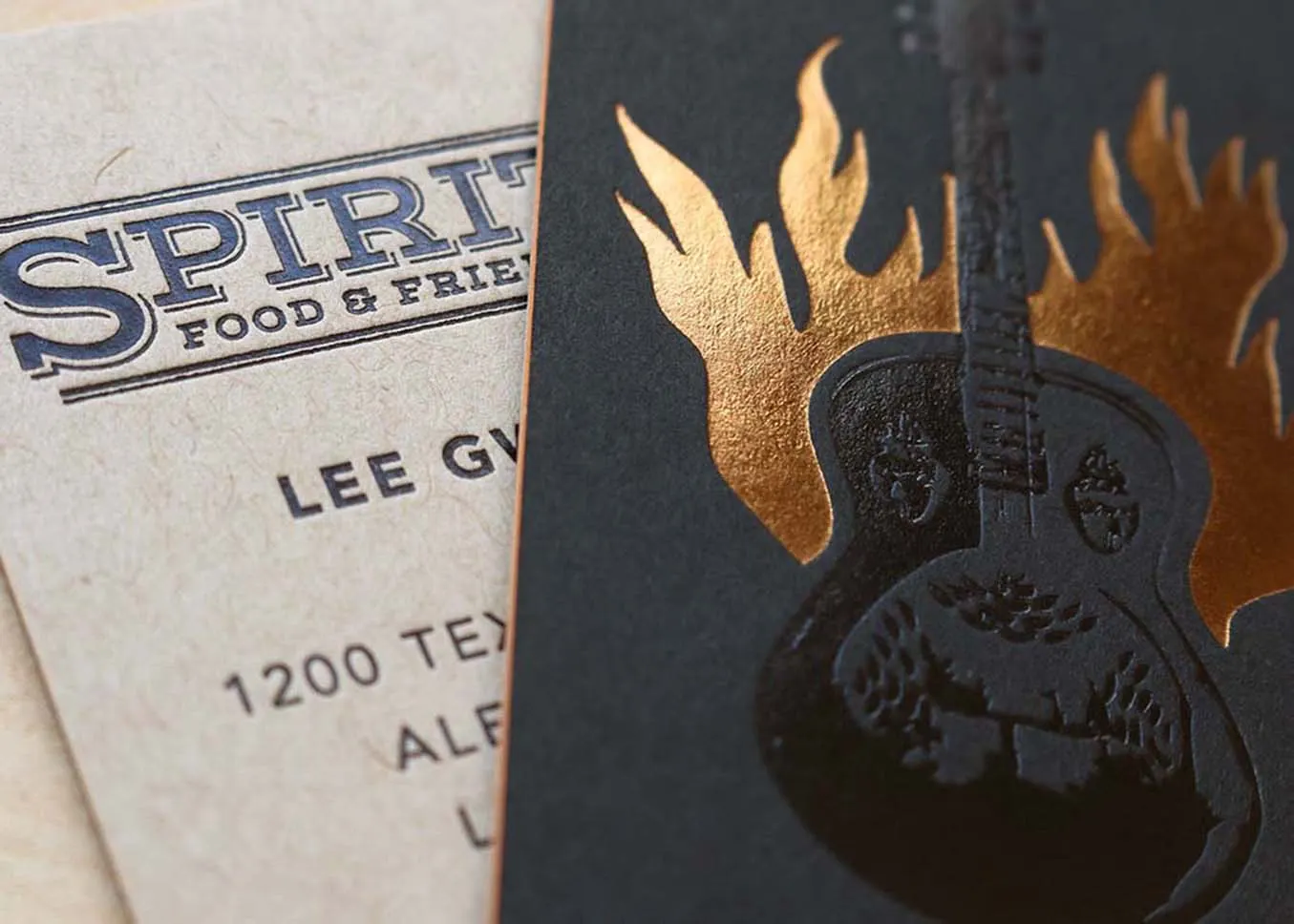 Quadplexed letterpress business cards with multiple foil colors on black and kraft papers