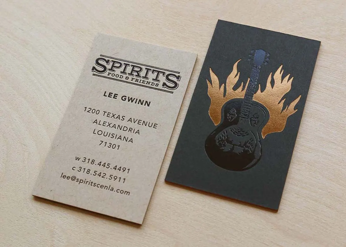 Back side of business card showing black letterpress printing on kraft French Speckletone paper