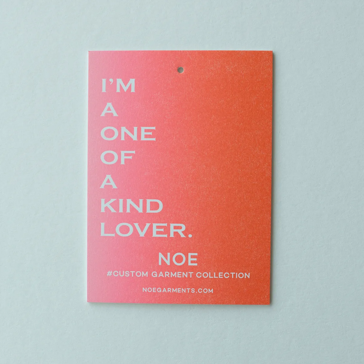 Single hang tag with a pink-to-red split fountain gradient showing the soft transition between ink colors