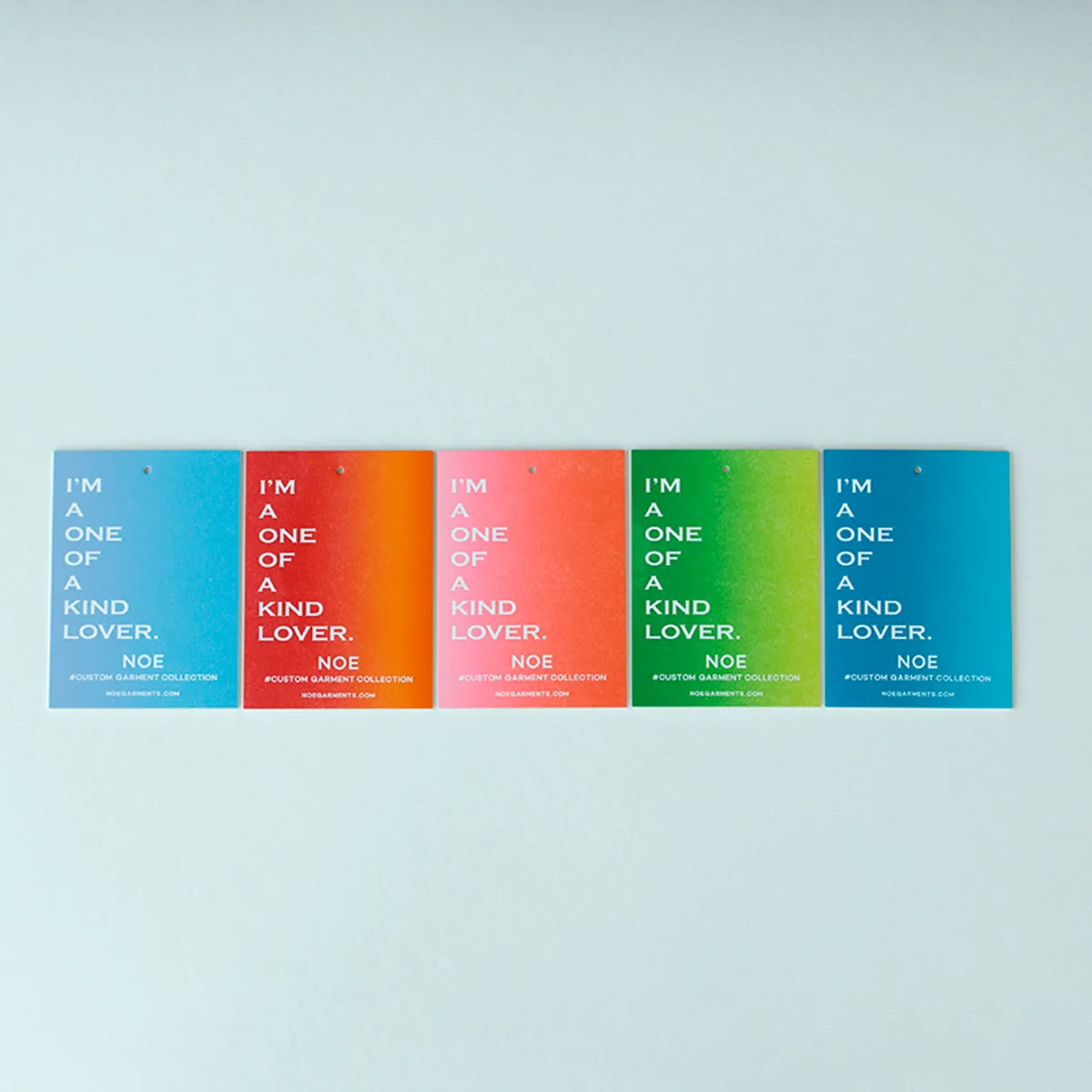 Single hang tag with a light-to-deep teal split fountain gradient and reversed white typography